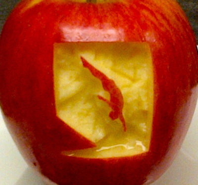 Diver carved into an apple